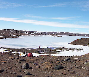 Apple hut at edge of frozen lake