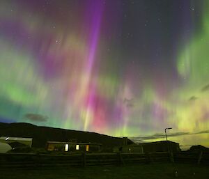 A rainbow aurora at Macca explodes in the sky above station