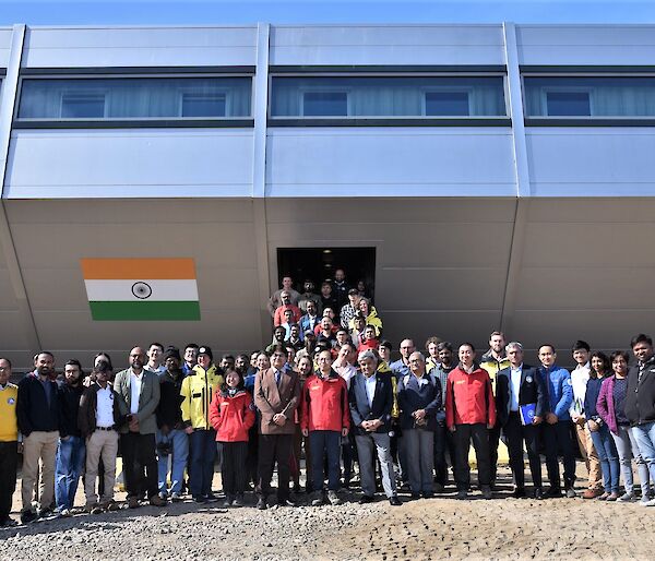 group of people standing in front of building