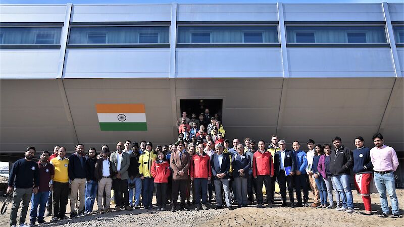 group of people standing in front of building