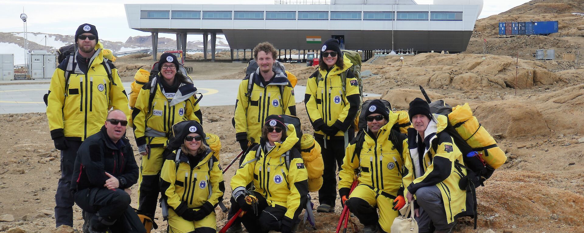 group of expeditioners in front of station building
