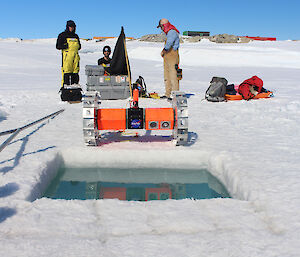 The NASA team prepare the robot for diving under the sea-ice in front of Australia’s Casey research station