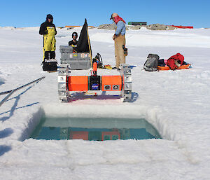 The NASA team prepare the robot for diving under the sea-ice in front of Australia’s Casey research station