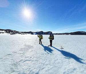 Two scientists on the ice fjord