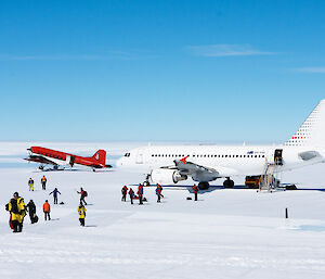 Expeditioners walking from two planes at Wilkins Aerodrome