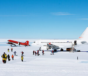 Expeditioners walking from two planes at Wilkins Aerodrome