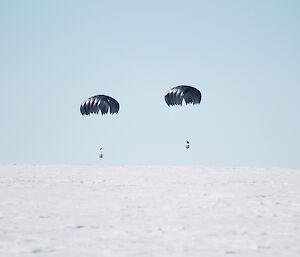 Two parachutes landing on the ice