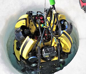 mini-sub is lowered into ice hole