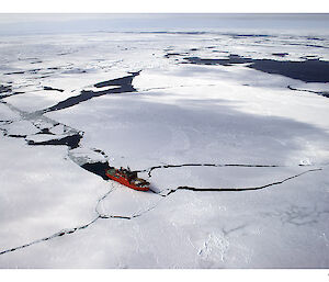 Aerial view of the Aurora Australis icebreaker in pack ice