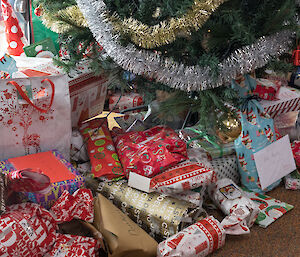 A pile of Christmas presents under the tree in the Red Shed at Casey