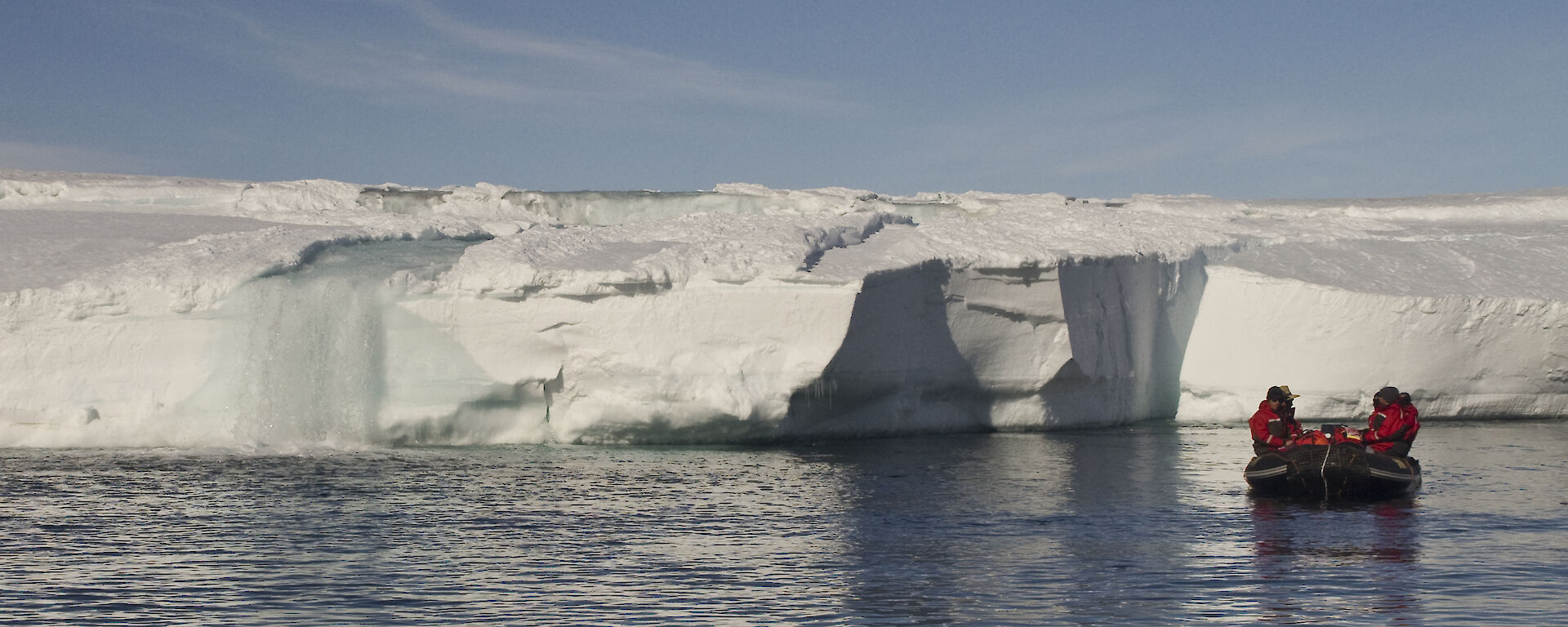 A river of water pours into the bay signifying the melt is in full swing in the Casey Station Operating Area