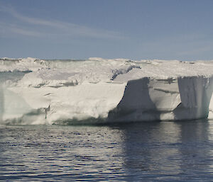 A river of water pours into the bay signifying the melt is in full swing in the Casey Station Operating Area