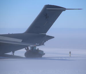 Tractor being unloaded from C17 aircraft