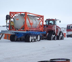 Tractor towing a fuel tank