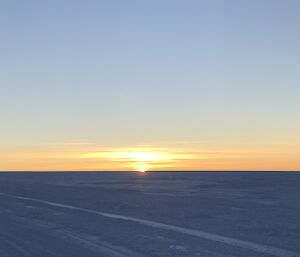 The sun rising over the ice plateau