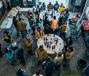 Large group of people at a BBQ in the operations building