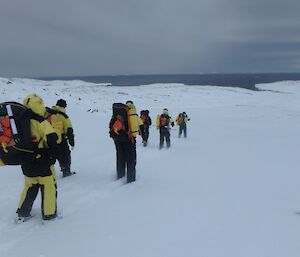 A group of expeditioners walking on the ice