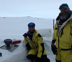Two expeditioners cooking on the ice