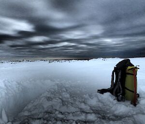 A view of the snowy landscape around the training area with a dark sky hiding the moon