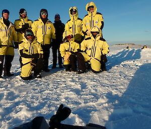 A group photo of expeditioners on the ice