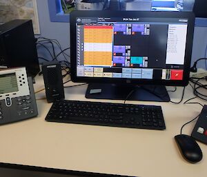 A desk with telephone and a computer