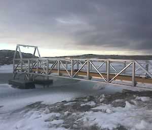 A pontoon getting lifted from the lake for repairs and repositioning