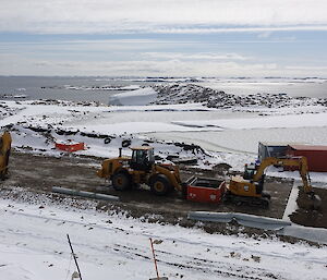 Three heave plant vehicles working at a remediation site