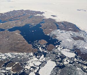 Aerial view of rocks and ice sheets of Antarctica