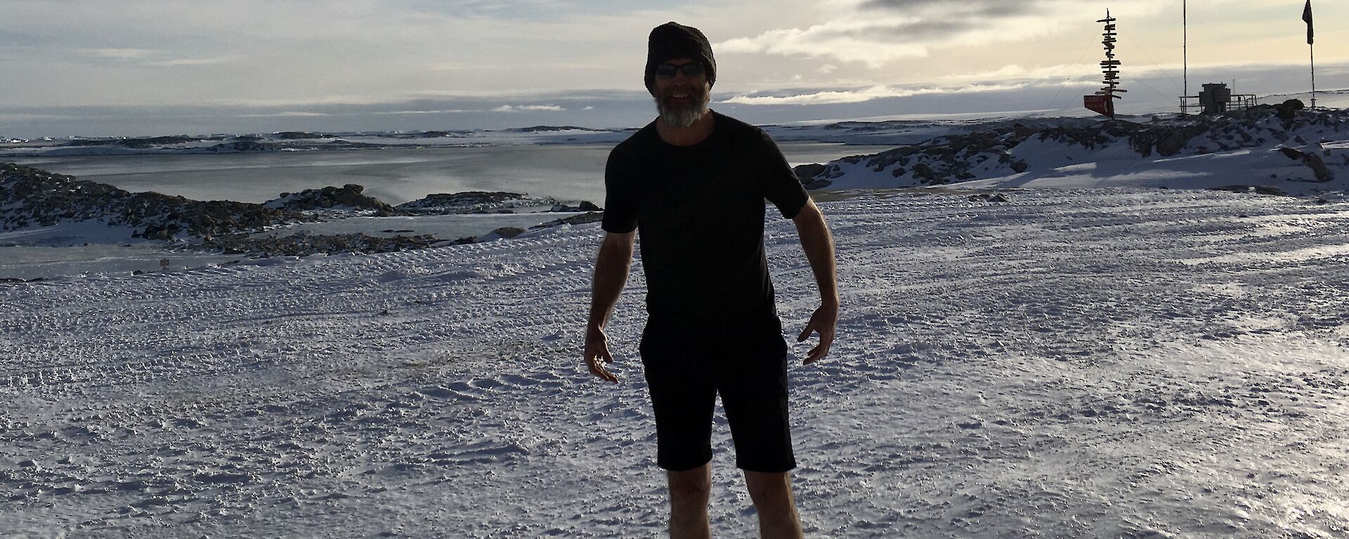 Expeditioner on the ice wearing winter woollies and shorts!