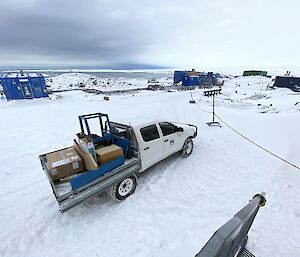 A ute filled with boxes on the ice