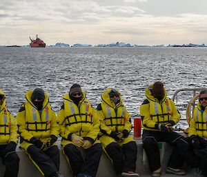The last barge load of yellow-clad expeditioners are carried safely to the RSV Aurora Australis, on anchor in the background