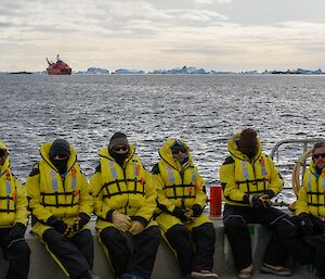 The last barge load of yellow-clad expeditioners are carried safely to the RSV Aurora Australis, on anchor in the background