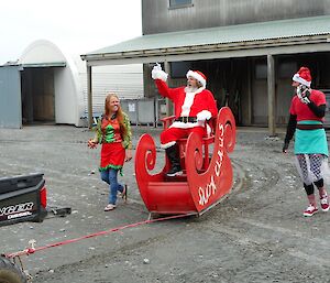 Santa arrives on Christmas day at Macqurie Island station in a sleigh