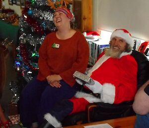 expeditioner sits on Santa’s knee