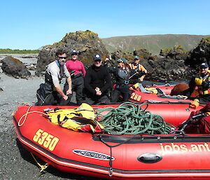 Expeditioners beside boats