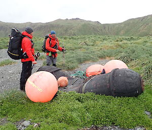 Two rangers and large rubber fender and buoys