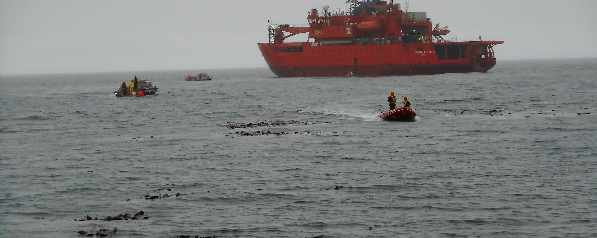 Two watercraft heading ashore from the icebreaker ship