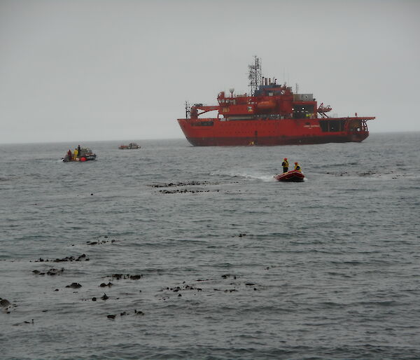 Two watercraft heading ashore from the icebreaker ship