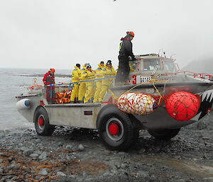 Incoming station crew arriving by Lighter Amphibious Resupply Cargo truck