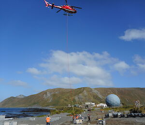 A helicopter slung load arrives at station