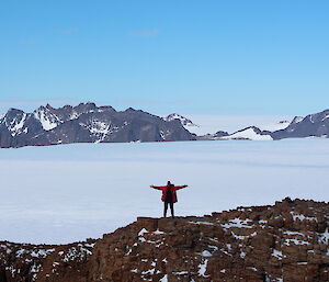 Snow covered landscape with mountains in the distance