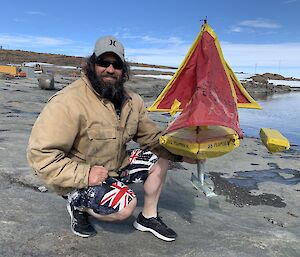 a man with his hand made sail boat