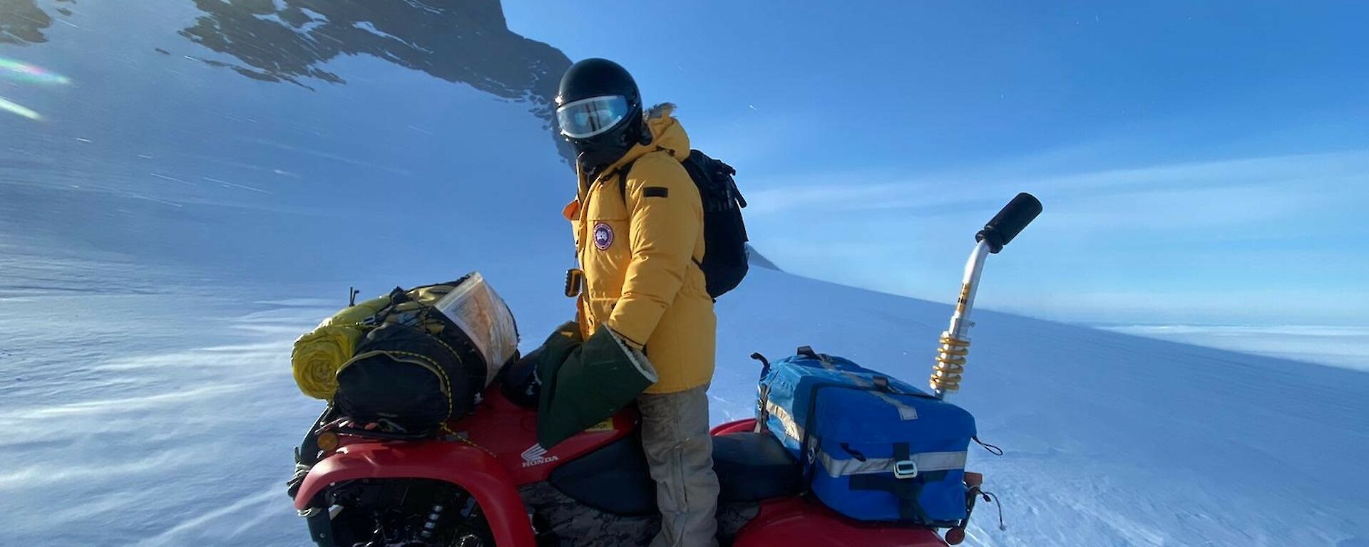 Expeditioner on a quad bike on the ice