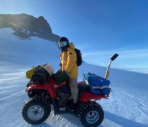 Expeditioner on a quad bike on the ice