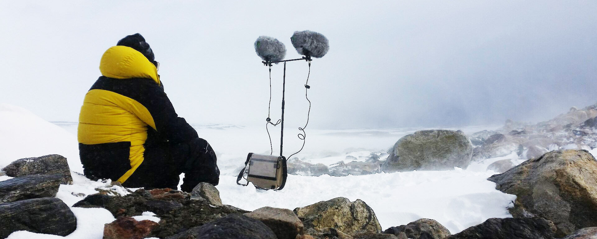 Sound artist recording the howl of the blizzard