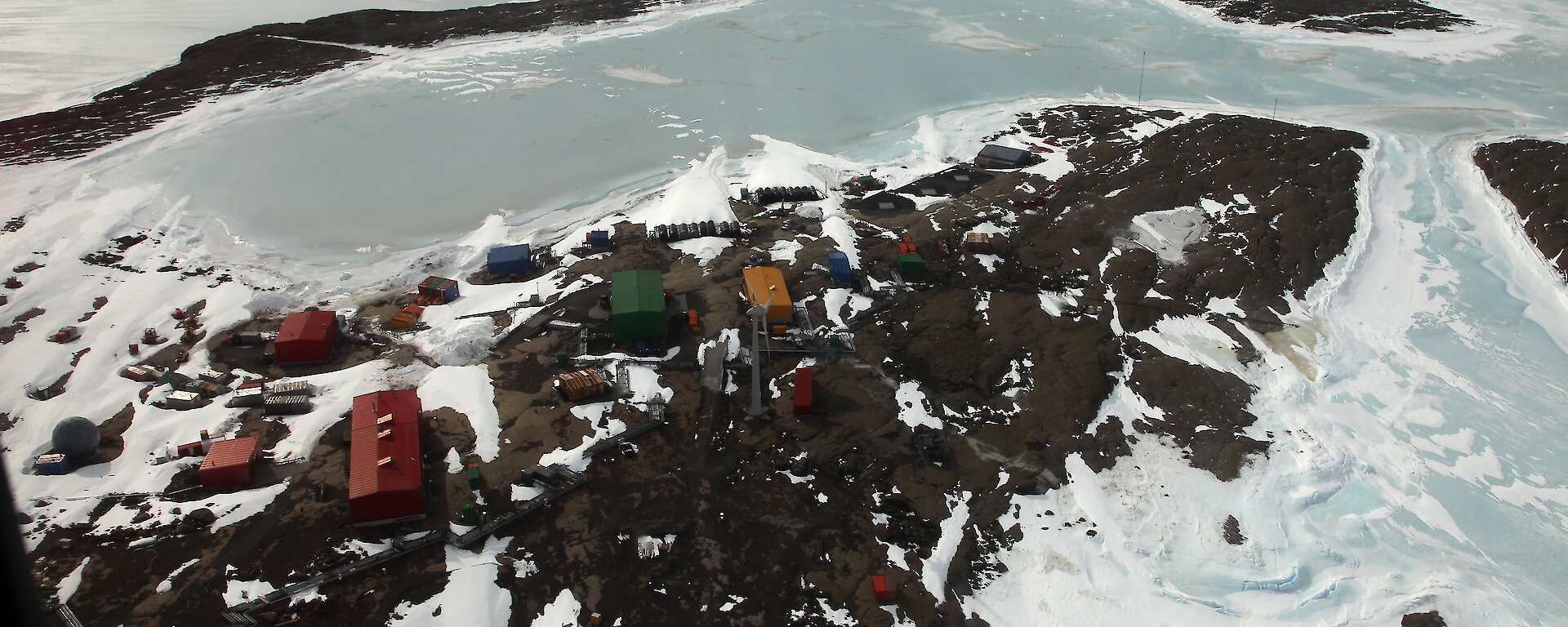 Picturesque Mawson research station, an ice-covered Horseshoe Harbour, and West Arm.