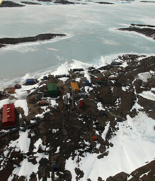 Picturesque Mawson research station, an ice-covered Horseshoe Harbour, and West Arm.