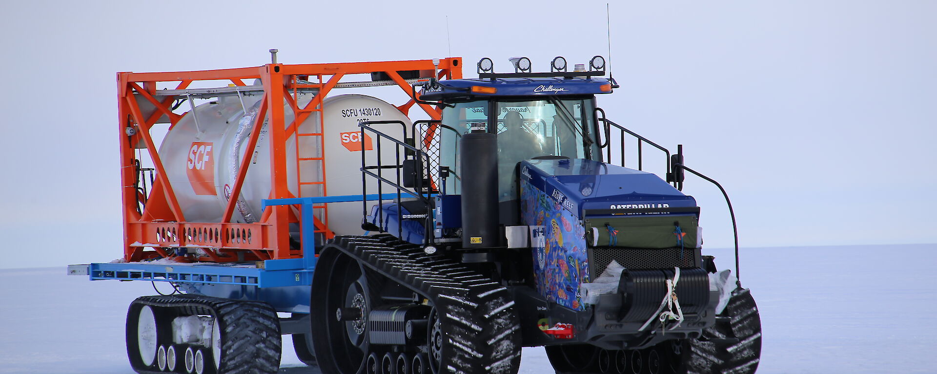 A tractor towing a fuel cylinder in Antarctica.