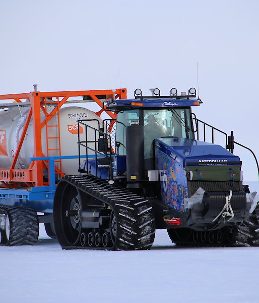 A tractor towing a fuel cylinder in Antarctica.