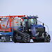 A tractor towing a fuel cylinder in Antarctica.